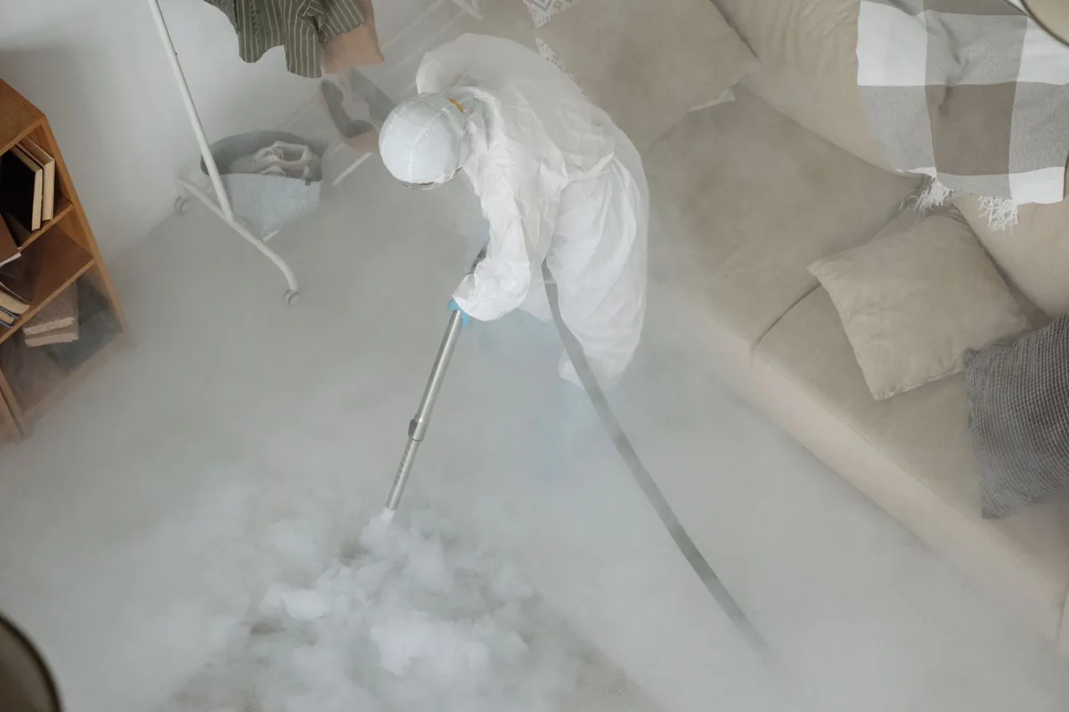 Biohazard cleanup technician in protective equipment, Paducah, TX